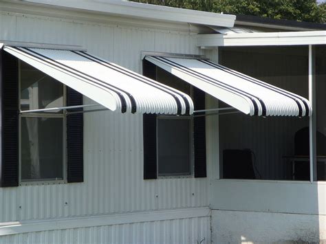 which awning is better fabric or metal|durability of metal awnings.